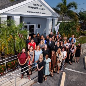 Integrity Employee Leasing team of experts celebrates 20 years of serving clients in front of Port Charlotte office